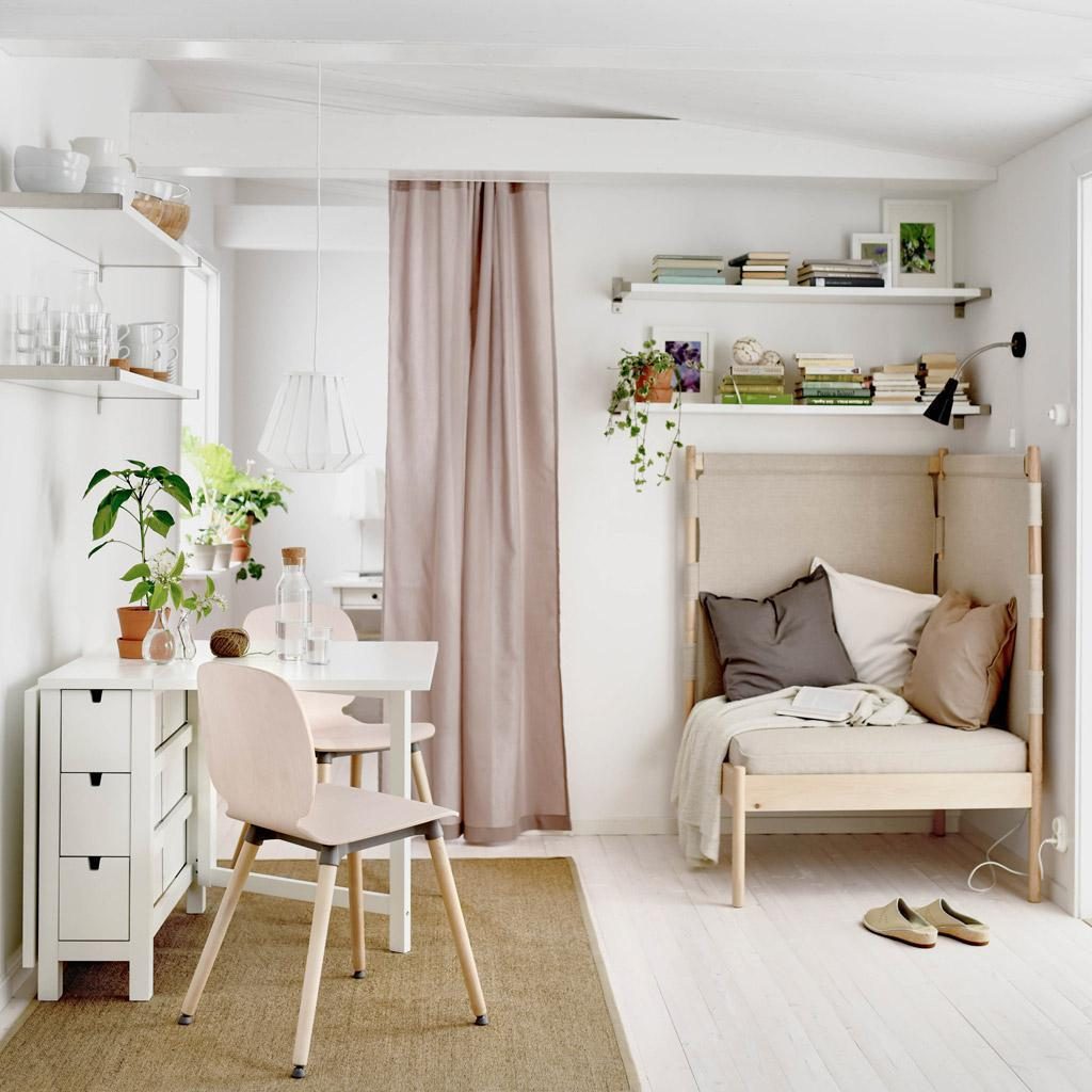 Calm Japanese-style corner with pale wood, linen curtain and daybed