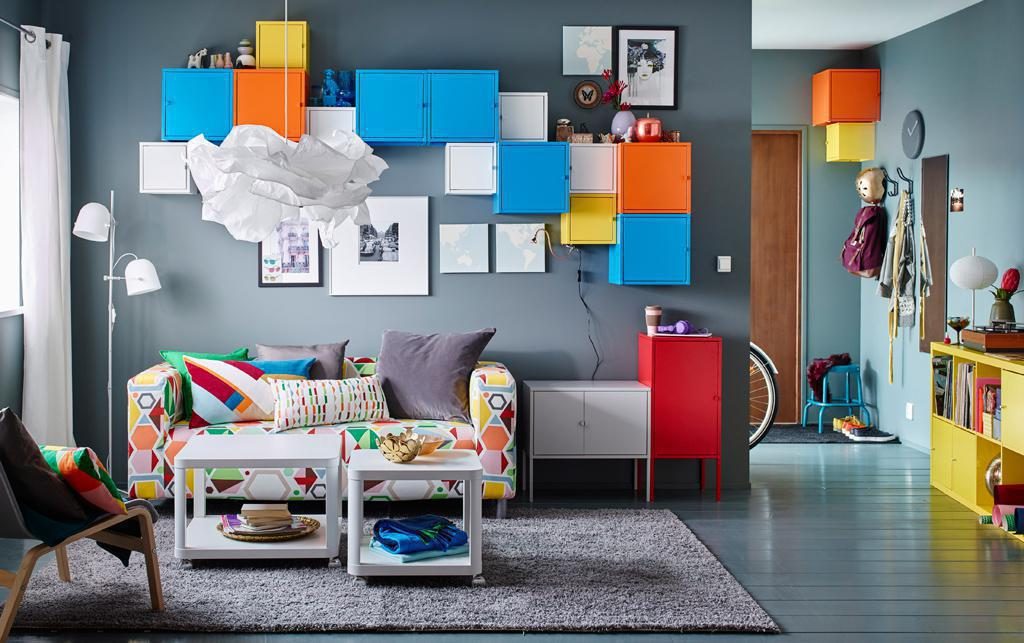 Colourful maximalist living room with bright wall cabinets